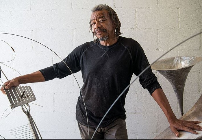 Joe Willie Smith with found object musical sculpture